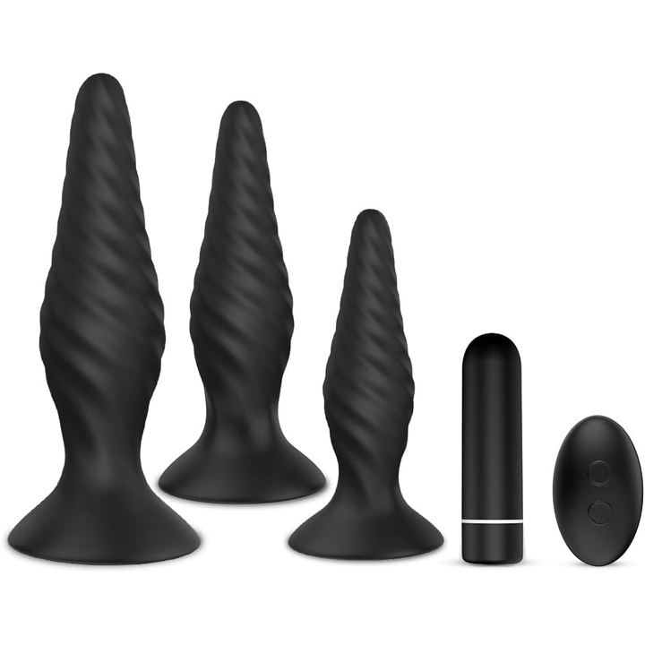 Verschiedene schwarze Analplugs und Vibrator